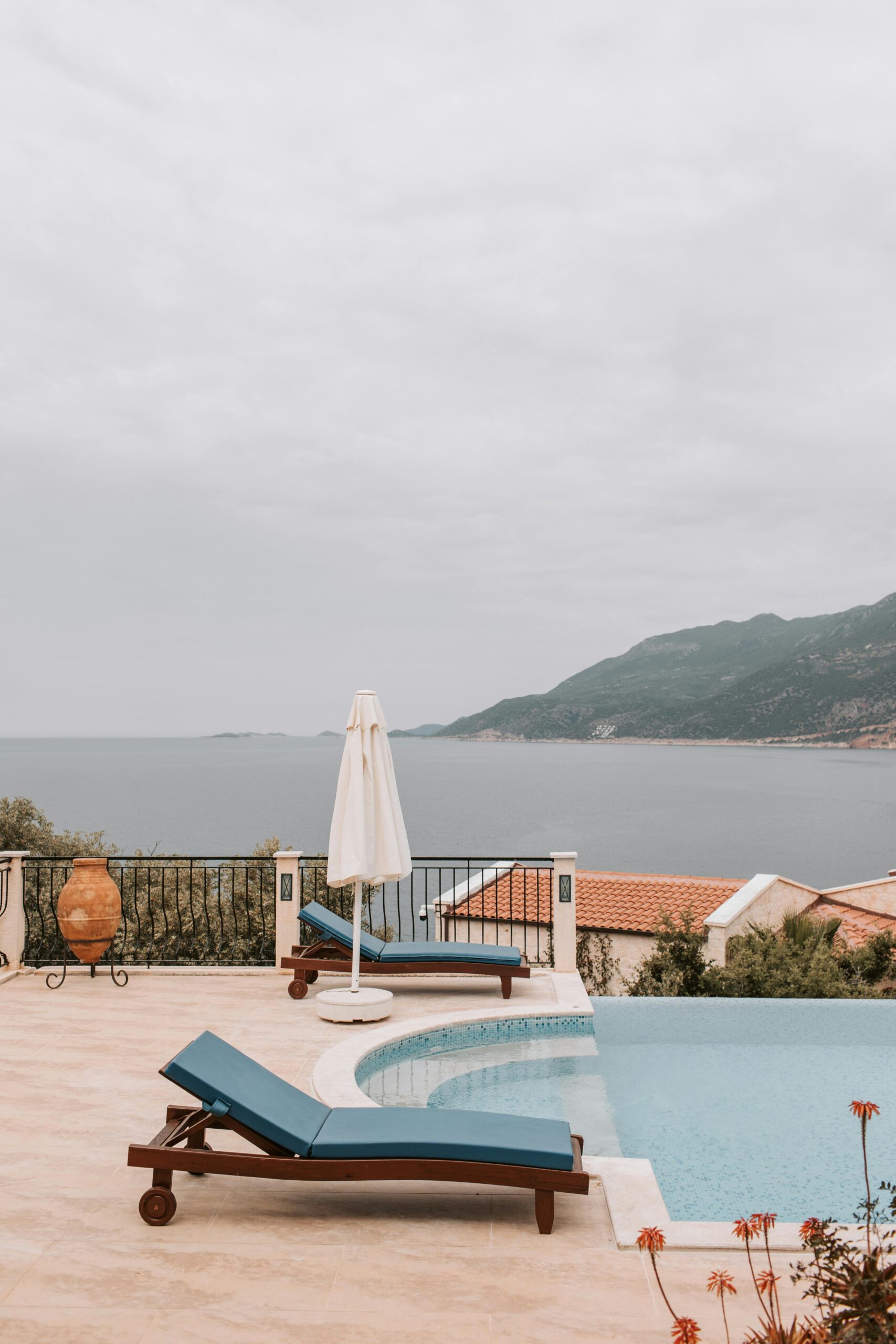 Relaxing poolside view overlooking the Mediterranean Sea at a luxury villa in Antalya, Turkey.
